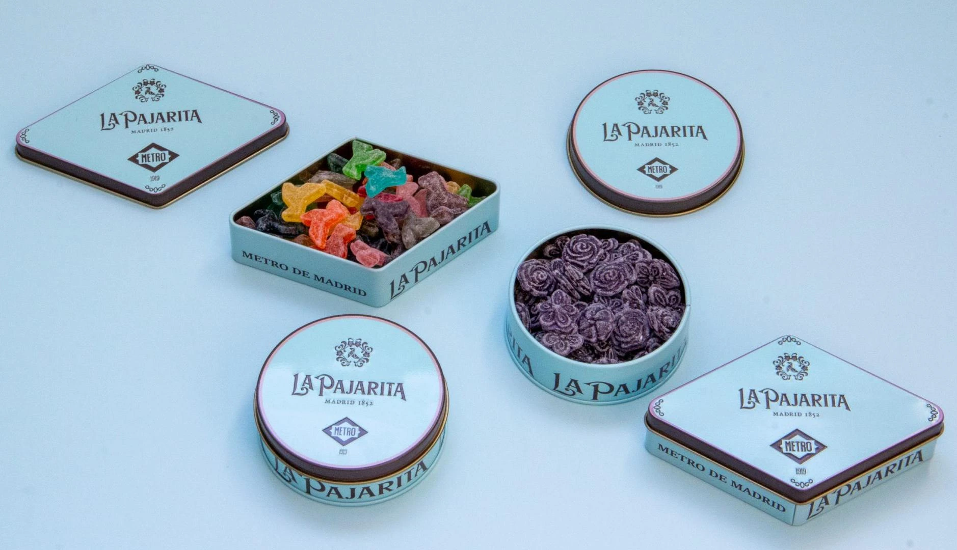 Latas de edición limitada de Metro de Madrid y La Pajarita con caramelos de colores de las 12 líneas del metro